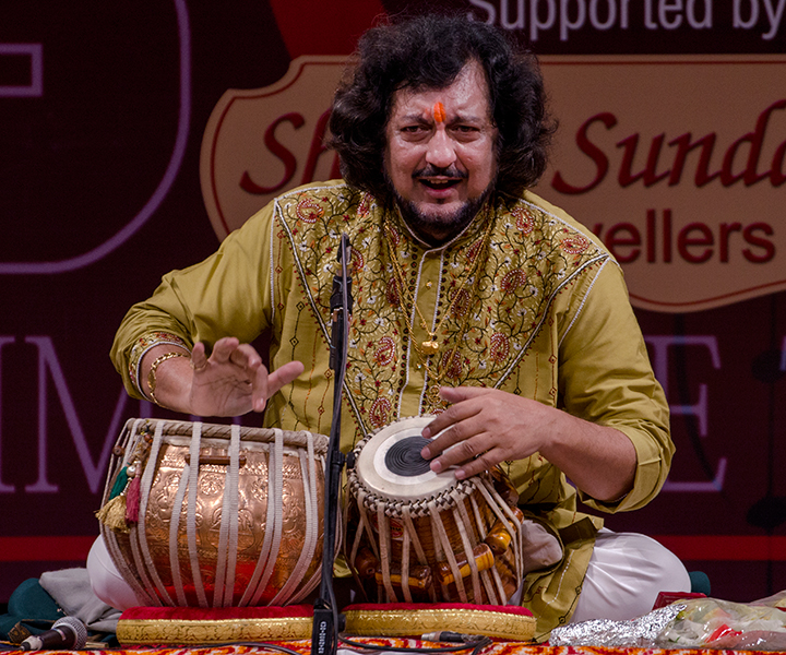 Kumar Bose plays the tabla on stage